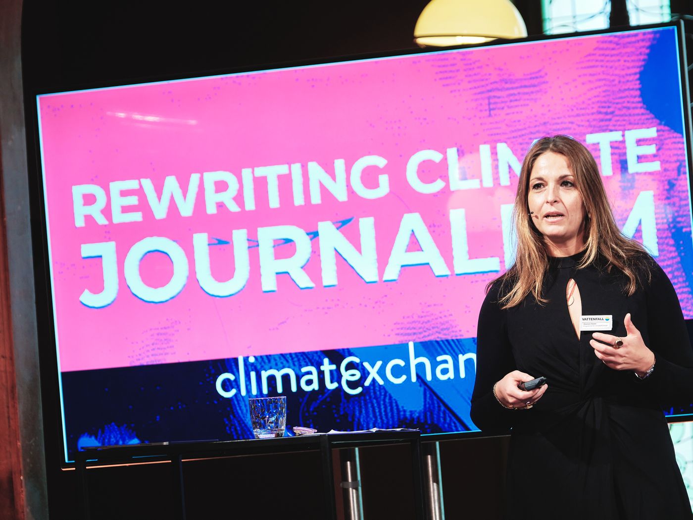 A speaker presents "Rewriting Climate Journalism" at a climateXchange convening